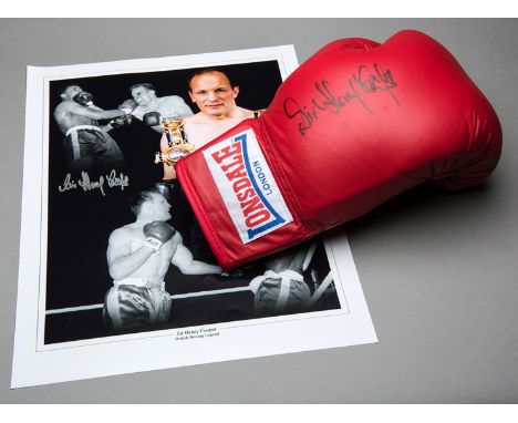 A Sir Henry Cooper signed boxing glove,
a red right-hand Lonsdale signed in black marker pen; sold with a Cooper-signed "Brit