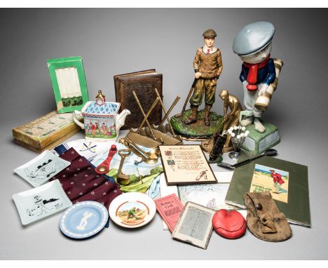 Golf collectibles,
including a boxed Biffit Golf Practice Set; a resin reproduction of the famous Dunlop Man golf ball advert