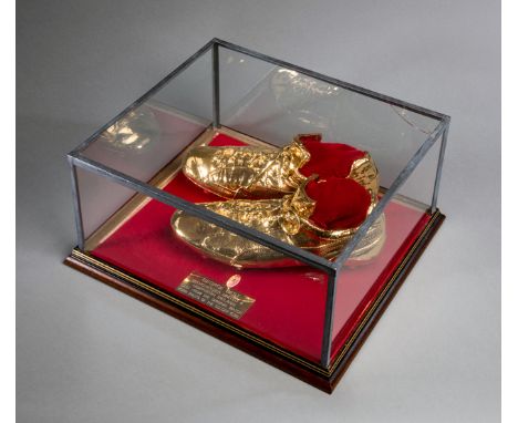 A pair of gold ceramic football boots cast from original George Best match-worn boots,
No.2 from an individually hand crafted