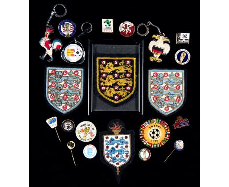 A collection of football badges,
including three Football Association silk & wirework blazer badges, and a framed cloth badge