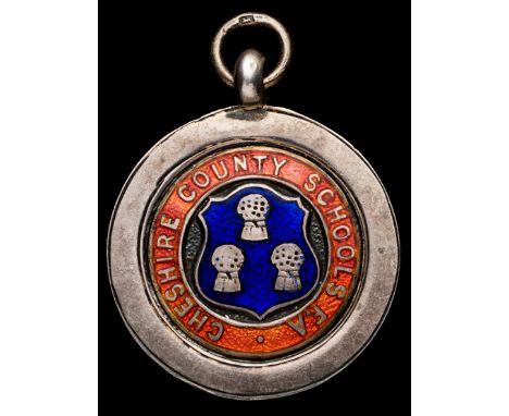 A football medal of Chelsea interest,
a Cheshire County Schools F.A. silver & enamel medal inscribed to F. Blunstone in seaso