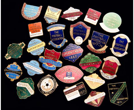 A group of 24 gilt-metal & enamel Football Association Superintendent's badges dating between 1960 and 1981,
each inscribed T