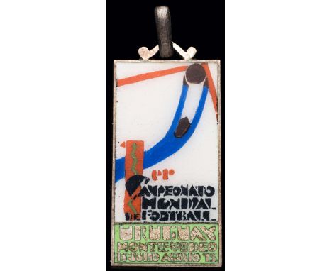 A hallmarked .800 silver & enamel 1930 World Cup medal with the poster design,
by Stefano Johnson of Milan, the obverse ename