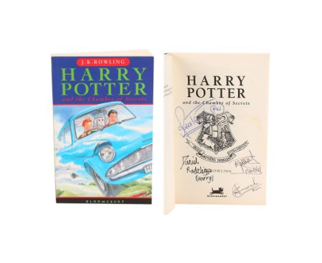 HARRY POTTER AND THE CHAMBER OF SECRETS (2002) - Daniel Radcliffe and Cast-Autographed Paperback Book - A paperback copy of J