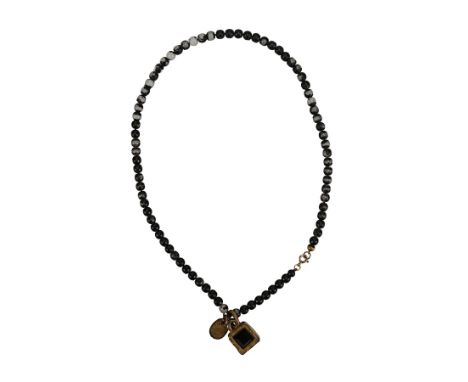 MICHAEL JACKSON - The Omer Bhatti Collection: Michael Jackson's Black-beaded Necklace with Stone - A black-beaded necklace pr