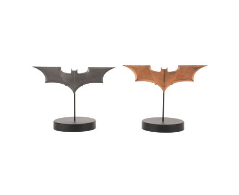 BATMAN BEGINS (2005) - Stunt Batarang and Batcave Worktable Batarang - A stunt Batarang and a Batcave worktable Batarang from
