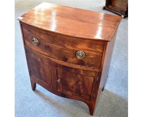 A GEORGE III MAHOGANY BOWFRONT COMMODE  on bracket feet, 60cm wide 39cm deep 68cm high