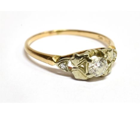 A DIAMOND SOLITAIRE 14 CARAT GOLD RING  with small diamonds to shoulders, the round brilliant cut diamond approx. 0.20 carat,