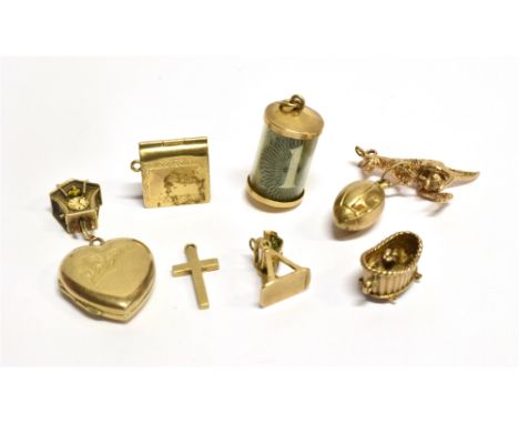 NINE ASSORTED 9 CARAT GOLD CHARMS  to include a one pound note in cylinder, kangaroo, cuckoo clock etc., total gross weight a