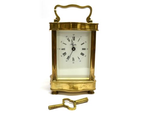A FRENCH 8-DAY CARRIAGE CLOCK IN SERPENTINE FRONT LACQUERED BRASS CASE the enamel dial with Roman and Arabic numerals, signed