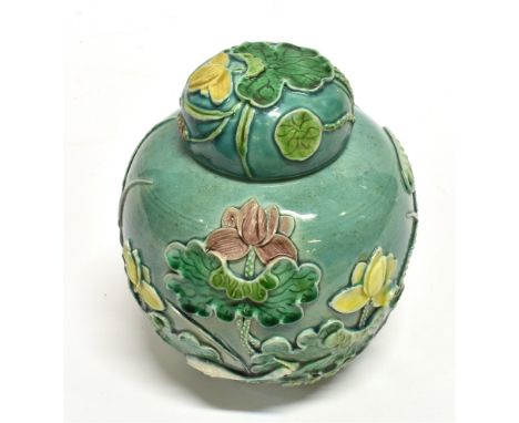 A CHINESE GINGER JAR AND COVER  with relief decoration of a crane and foliage, seal type raised mark to base, 14.5cm high