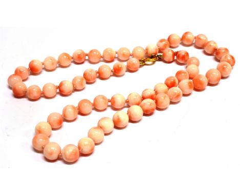 A CORAL NECKLACE WITH 9CT GOLD BOLT RING FASTENER  the uniform white and orange coral beads approx. 7mm diameter average each