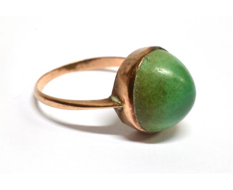 A GREEN SINGLE STONE SET ROSE GOLD DRESS RING the oval cabochon cut stone approx. 13mm x 12mm, bezel set plain polished rose 