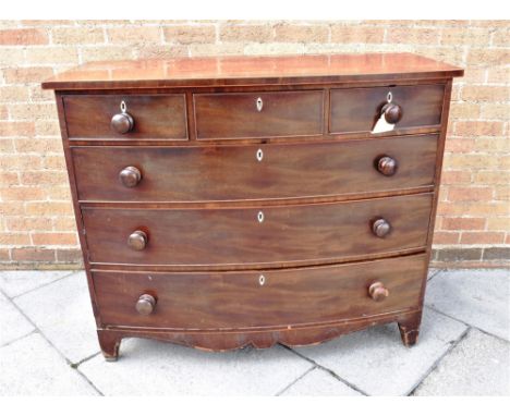 A 19TH CENTURY MAHOGANY BOW FRONT CHEST OF THREE SHORT AND THREE LONG DRAWERS  with bone escutcheons, on bracket feet with sh