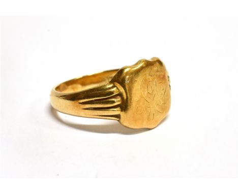 A GENT'S 18CT GOLD SIGNET RING  shield shaped front with monogrammed initials, grooved shoulders to plain polished hallmarked