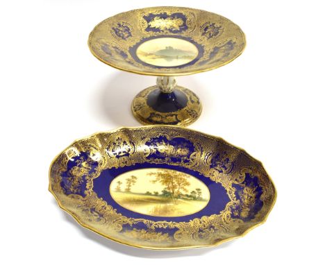 A SPODE CABINET PLATE  the reserve painted with a landscape scene signed 'perry', on a Royal blue ground hieightened in gilt,