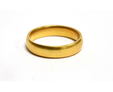 A HALLMARKED 22CT GOLD PLAIN WEDDING BAND  the D profile band 4mm wide, ring size L½, weighing 5.2 grams Condition Report : C