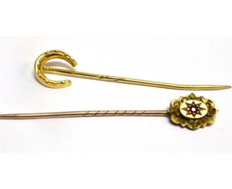 TWO GOLD STICKPINS  comprising an 18 carat gold horseshoe and a 15 carat gold small ruby set head, gross weight 3.0 grams Con