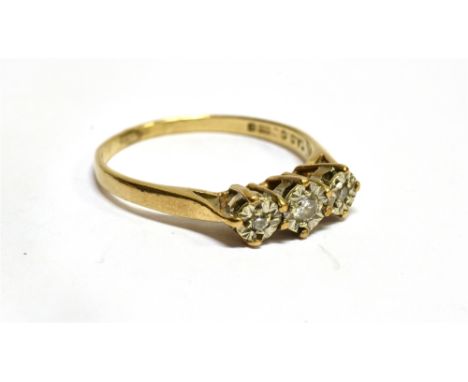 A DIAMOND THREE STONE 9 CARAT GOLD RING  three small round brilliant cut diamonds, illusion set, ring size P, gross weight 1.