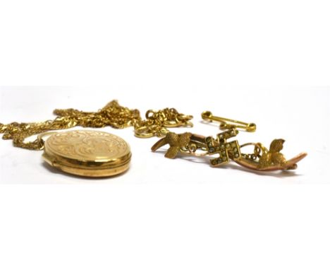 A 9 CARAT GOLD OVAL LOCKET AND CHAIN the locket with scroll and leaf decoration to front, 25mm x 20mm, on a 9 carat gold chai