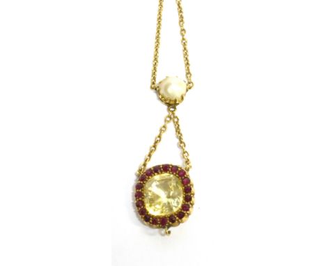 AN EDWARDIAN YELLOW SAPPHIRE AND RED SPINEL CUSHION SHAPED CLUSTER DROP PENDANT suspended from half pearl bale, continuing to