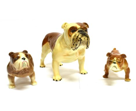 THREE CERAMIC BULLDOG FIGURES:  the largest model a 'Basford Bristish Mascot' 14cm high