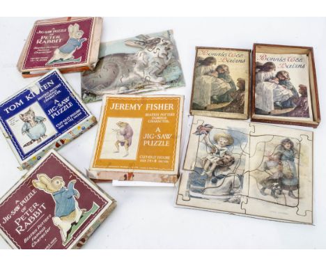Various dissected wooden puzzles,  a T. Nelson and Sons Bonnie Wee Bairns, in original wooden box with sliding lid and book -