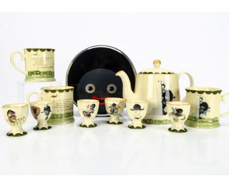 Carltonware Florence K Upton Golly ceramics, a teapot --6¼in. (16cm.) high; three mugs and six egg cups; and a Singapore Toy 