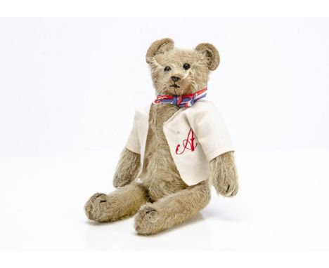 A Steevans jingling teddy bear circa 1915,  with golden mohair, black boot button eyes, pronounced muzzle, black stitched nos