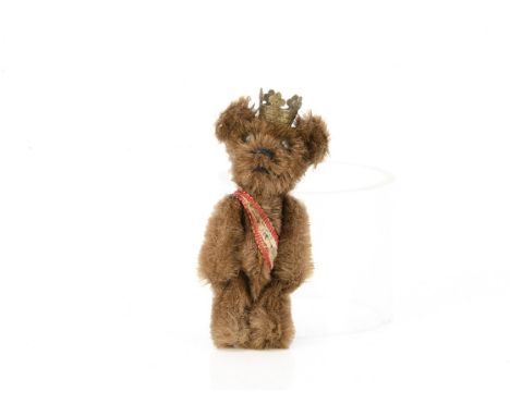 A Schuco miniature Berlin teddy bear 1950s,  with brown mohair, black metal pin eyes, black stitched nose and mouth, swivel h