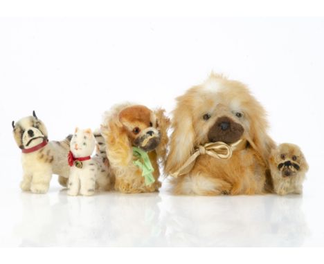 Three post-war Steiff dogs,  a Peky Pekinese with script button --6¾in. (17cm.) long; another smaller and a bulldog; a Russ P