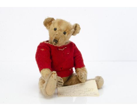 An early American teddy bear circa 1907 with provenance, with golden mohair, black boot button eyes, pronounced muzzle, black