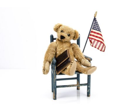 An early Ideal teddy bear circa 1908, with golden mohair, black boot button eyes, triangular shaped swivel head with pronounc