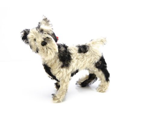 An unusual British black spotted terrier probably Farnell 1930s, white mohair with black tipped patches, clear and black glas