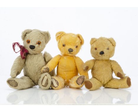 Three post-war Chad Valley teddy bears, a blonde mohair bear with replaced plastic eyes, black stitched nose and mouth, swive