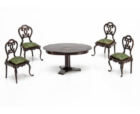 A rare Rock &amp; Graner painted tinplate dolls' house table and chairs, second half of the 19th century, painted with graine