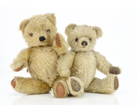 Two post-war Chad Valley teddy bears,  a blonde mohair bear with orange and black glass eyes, black stitched nose and mouth, 