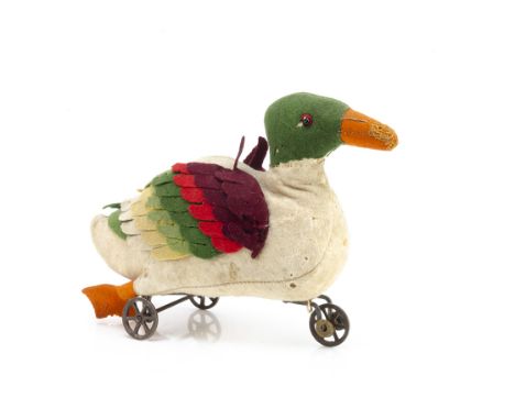 A German early felt duck on wheels circa 1908, the white body with green head, black bead eye with red felt behind, orange be