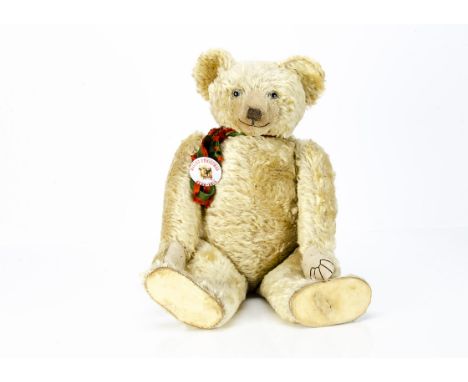 Pricey a large and fine Farnell teddy bear circa 1920,  with blonde mohair, clear and black glass eyes with remains of brown 