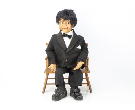 A Kallini Puppets ventriloquist male puppet,  with a mop of black hair, moving eyes and mouth and wearing dinner jacket, circ