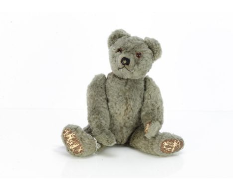 Larry Brown a 1940s Farnell brown wool plush teddy bear,  with orange and black glass eyes, pronounced muzzle, black stitched