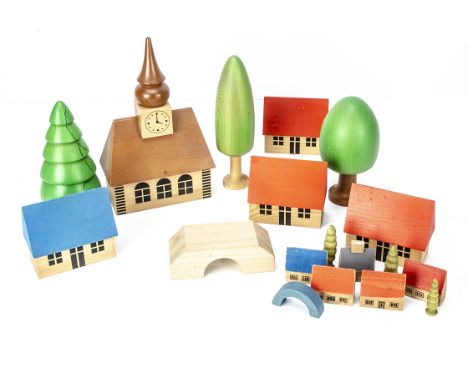 A recent large scale German village,  comprising church --10¼in. (26cm.) high, four houses, two trees and a bridge; and simil