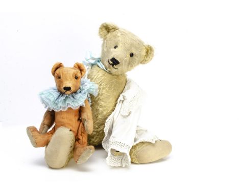 Two teddy bears,  an orange mohair teddy bear with black boot button eyes, pronounced muzzle, re-stitched nose and mouth, swi