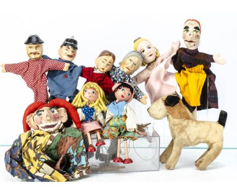 Four German carved wooden hand puppets, with cloth bodies --11¾in. (30cm.) high; two similar felt headed; two Pelham puppet g