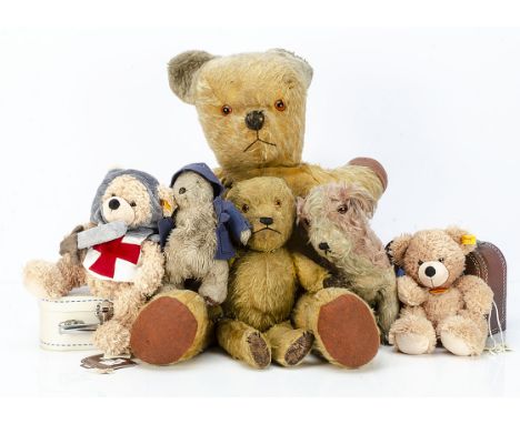 Old teddy bears and two Steiff bears in suitcases, a 1940s Chiltern teddy bear with orange and black plastic eyes and brown o