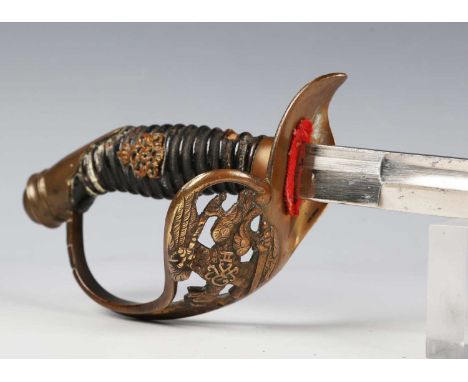 An 1889 pattern Prussian infantry officer's sword with single-edged fullered blade, blade length 83.5cm, cast brass hilt with