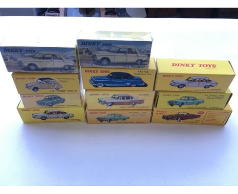 A collection of Atlas Dinky cars all boxed.