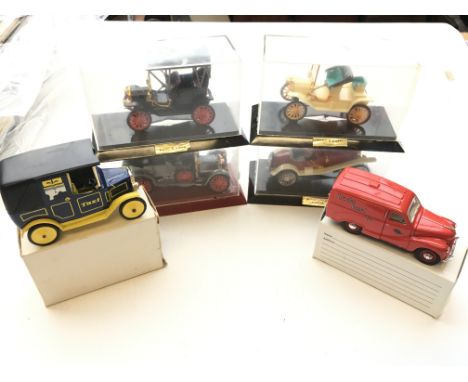 A collection of vintage Cars, a Matchbox 'Brooke Bond' tea van and a united biscuits promotional Taxi.