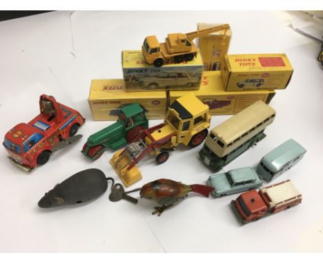 A mixed collection of toys to include a Schuco Mikifex clockwork mouse, clockwork bird, fire engine, 5 atlas editions, matchb