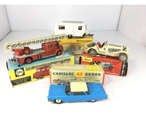 A lone star Cadillac 62 Sedan, a Zinkguss Mercedes Benz fire engine, a micro racer Mercedes Typ ss7 and a Marklin caravan #18